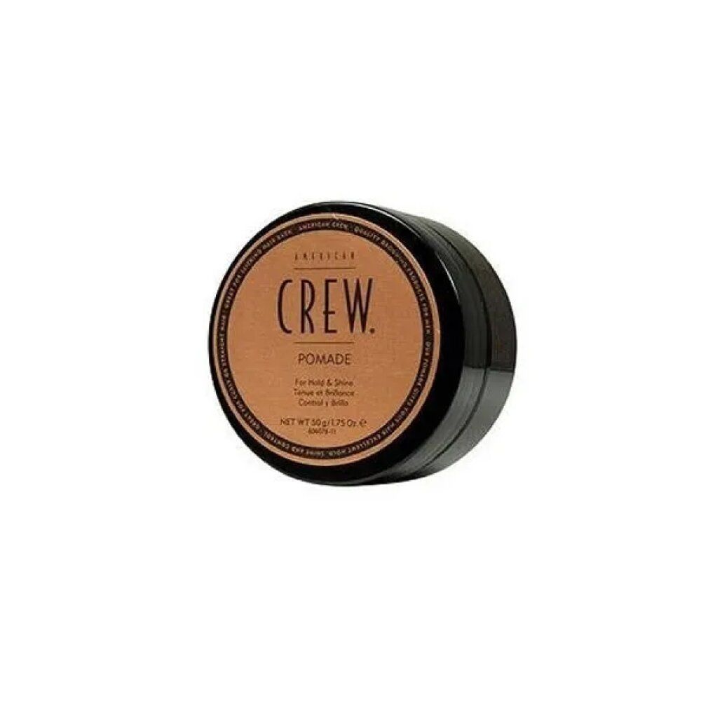 Barattolo nero rotondo con coperchio marrone. Scritta: CREW. Pomade. Per tenuta e lucentezza. Netto 50g/1.75 Oz.