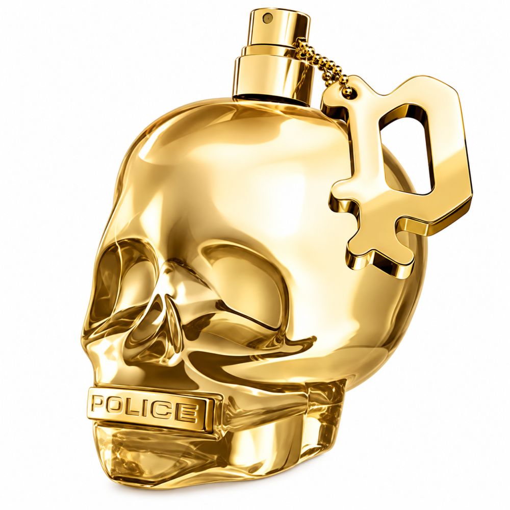 Flacone di profumo dorato a forma di teschio con ciondolo.