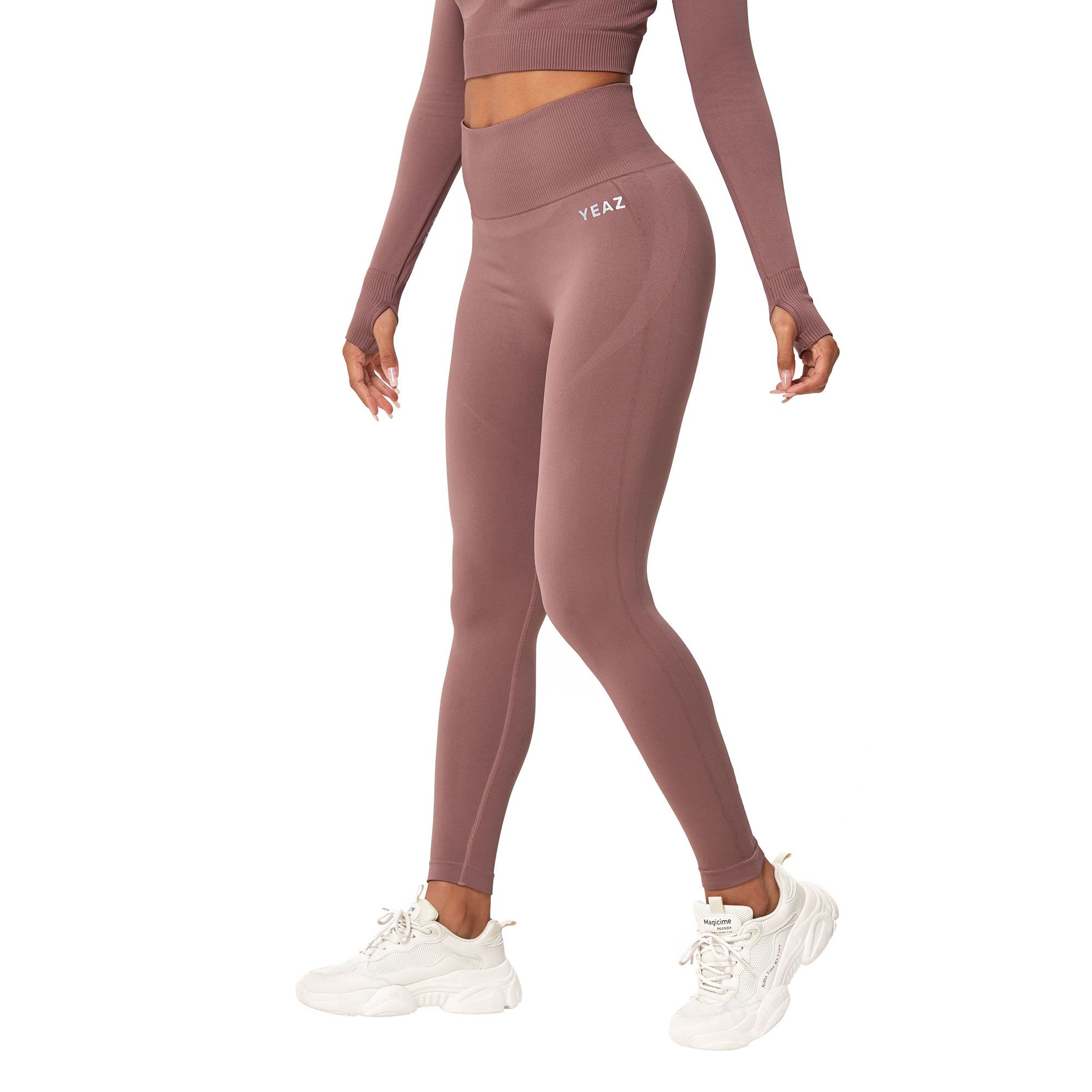 Leggings color malva senza cuciture con fori per i pollici e logo bianco.