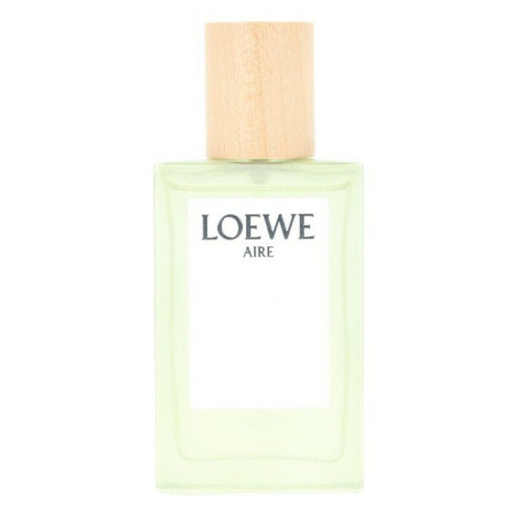 Flacone rettangolare con tappo in legno. Scritta LOEWE AIRE. Contiene liquido verde.