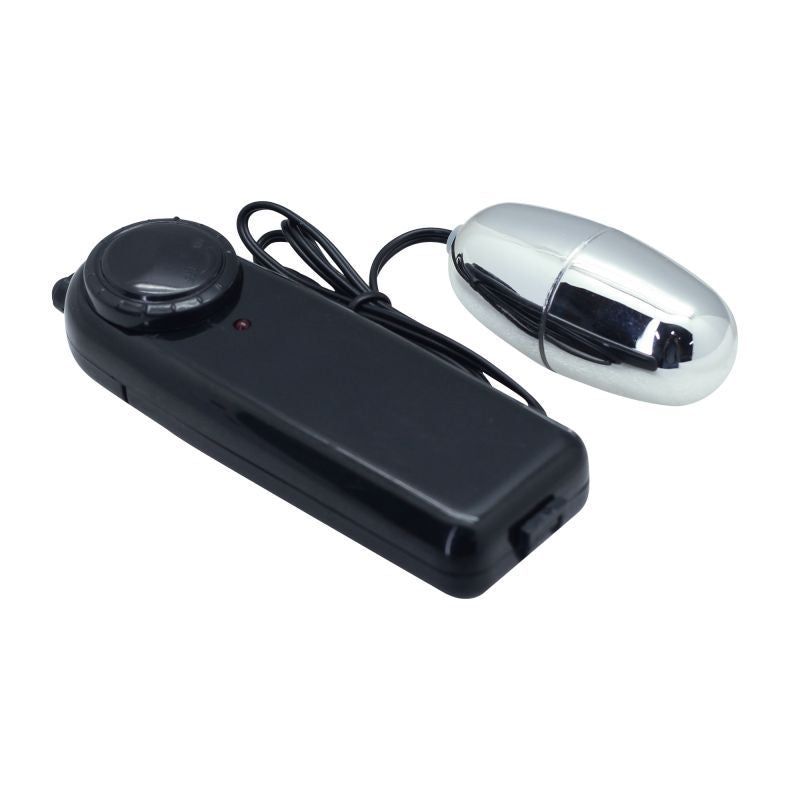 Vibratore a forma di uovo color argento accanto a un'unità di controllo nera. L'unità ha una manopola rotante e un LED rosso.