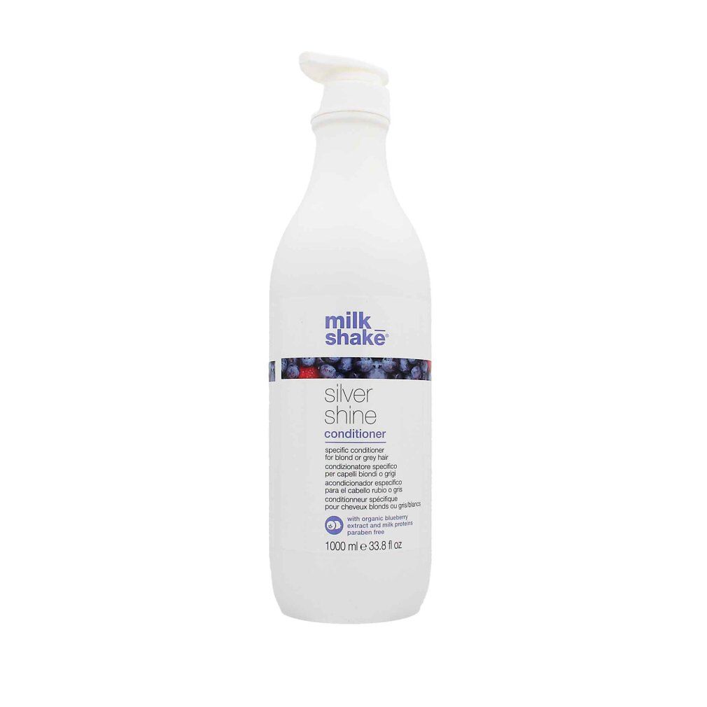 Flacone bianco con dosatore. Scritta: milk_shake Silver shine conditioner. Contiene estratto di mirtillo. 1000 ml.