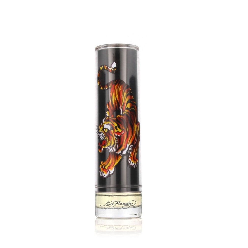 Ed Hardy Eau de Toilette Spray. Flacone cilindrico con design a tigre. Coperchio nero. Base in vetro trasparente con scritta.
