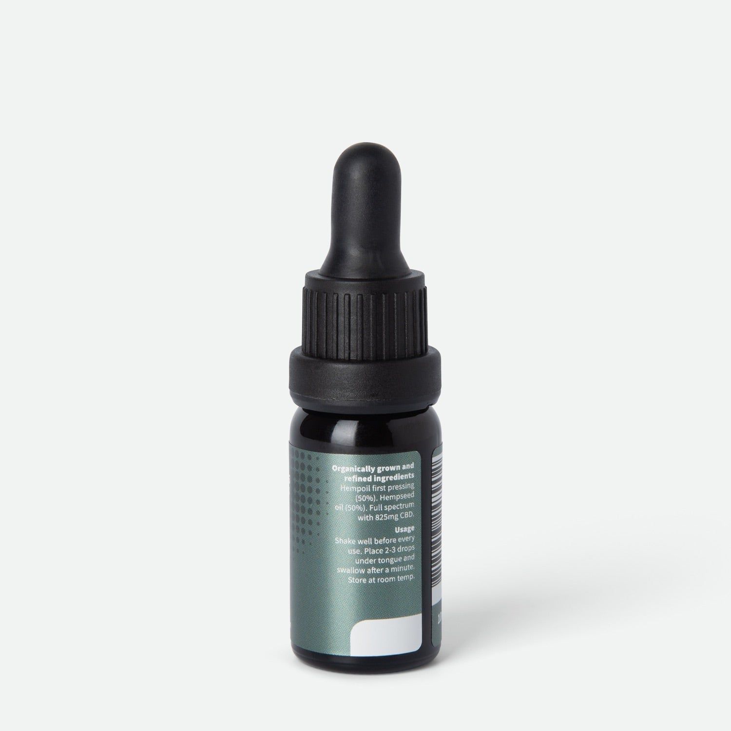 Vista posteriore di un flacone di vetro marrone con contagocce nero. Etichetta con testo sugli ingredienti e l'uso.