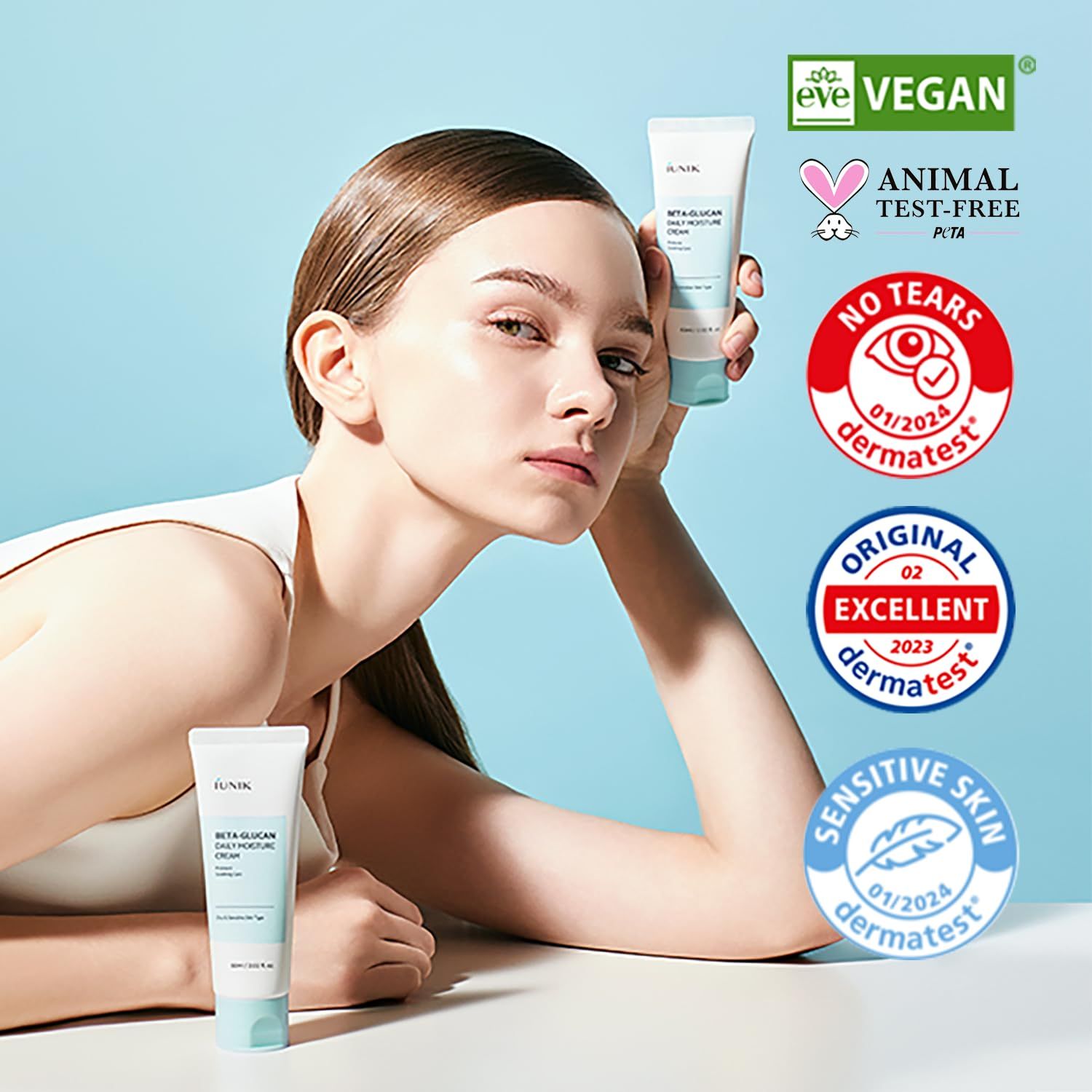 Donna con crema idratante iUNIK Beta Glucan, sigilli: Vegan, Cruelty-Free, Dermatest.