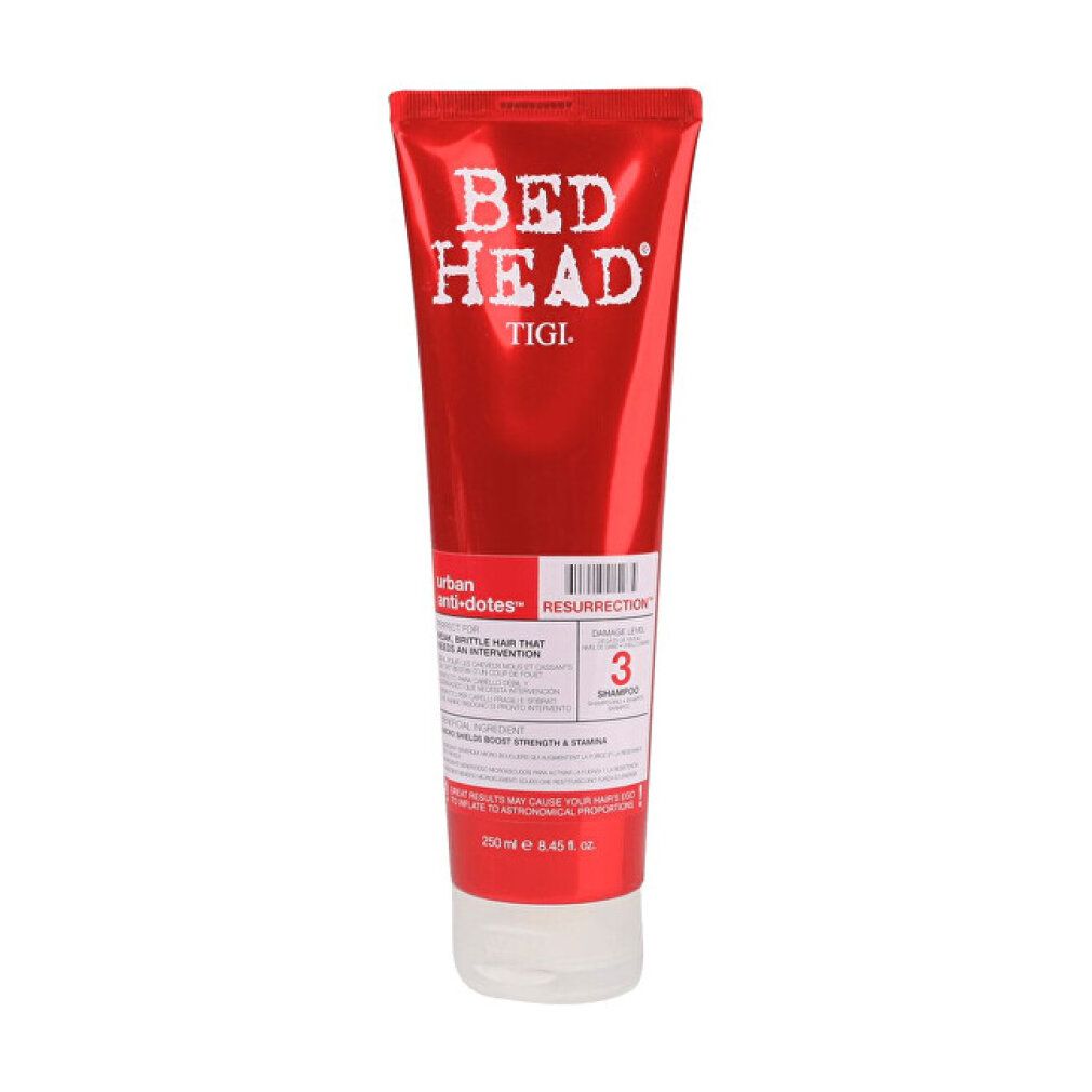 Tubo rosso con scritta bianca "BED HEAD" e "TIGI". Nome prodotto "RESURRECTION" e "3 SHAMPOOS".