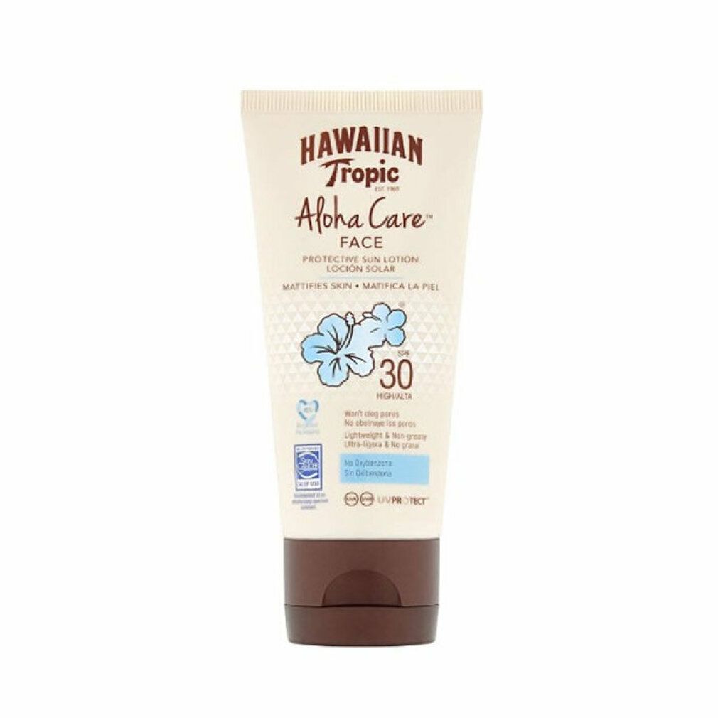Tubo di lozione solare con tappo marrone. Scritta: Hawaiian Tropic Aloha Care Face SPF30. Fiore blu e testo.