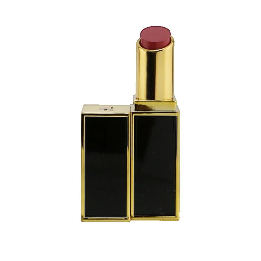 Rossetto aperto con custodia dorata e coperchio nero. La mina del rossetto è rossa. Sul coperchio c'è scritto TF.