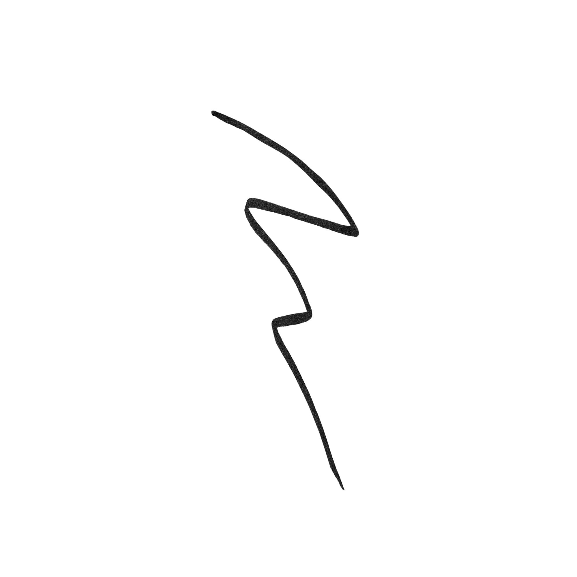 Tratto di eyeliner nero su sfondo bianco. Forma a zig-zag.