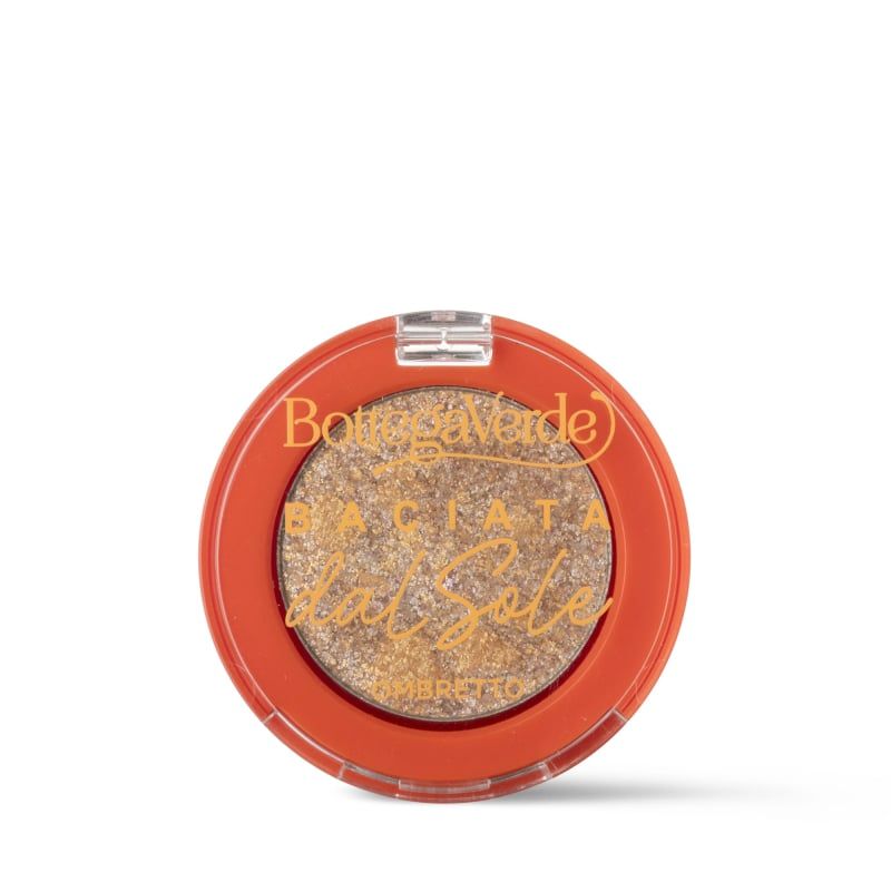 Ombretto rotondo arancione con ombretto dorato. Scritta: Bottega Verde, Baciata dal Sole, Ombretto.