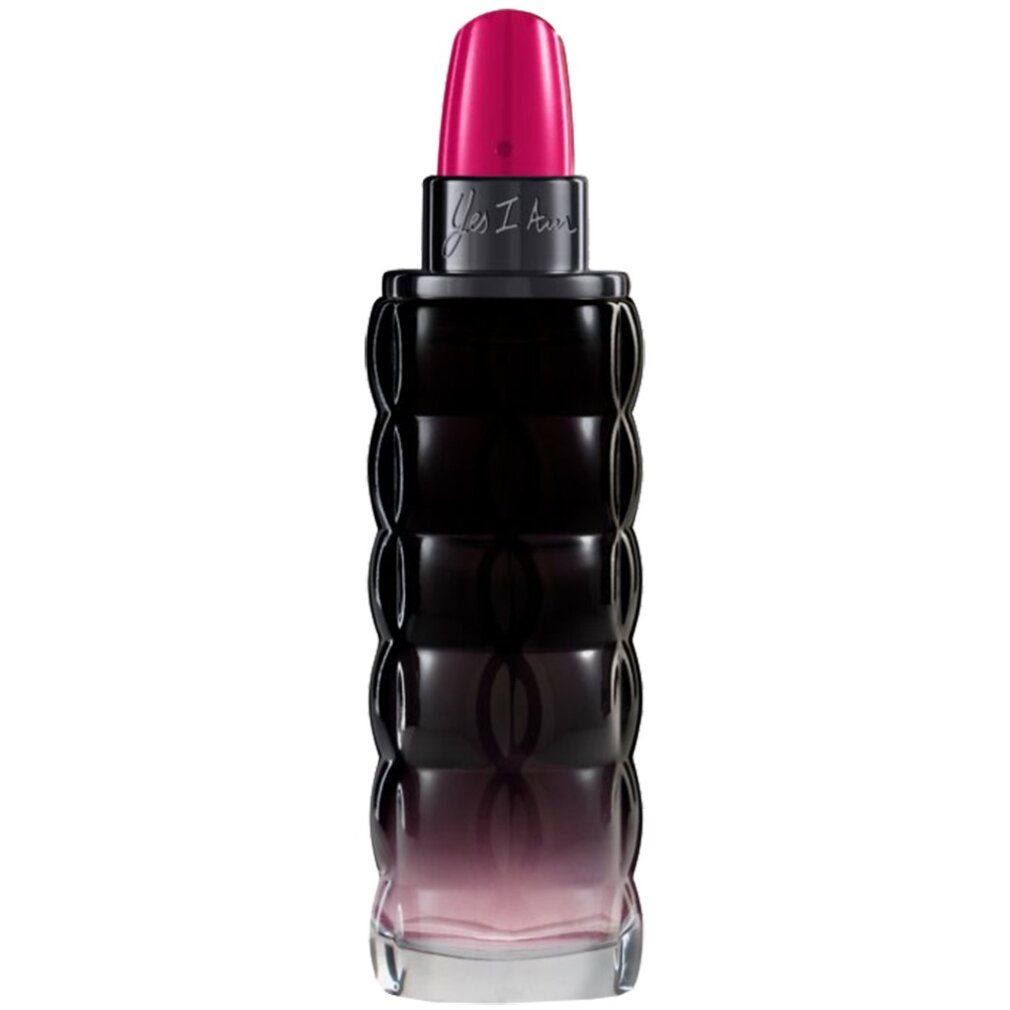 Flacone di profumo con tappo rosa. Vetro nero con design ondulato. Scritta "Yes I Am".