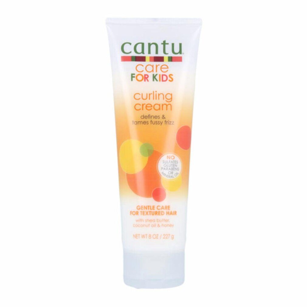 Tubo di crema arricciante Cantu Care For Kids. Bianco, con grafica e testo colorati. Contiene burro di karité, olio di cocco e miele.