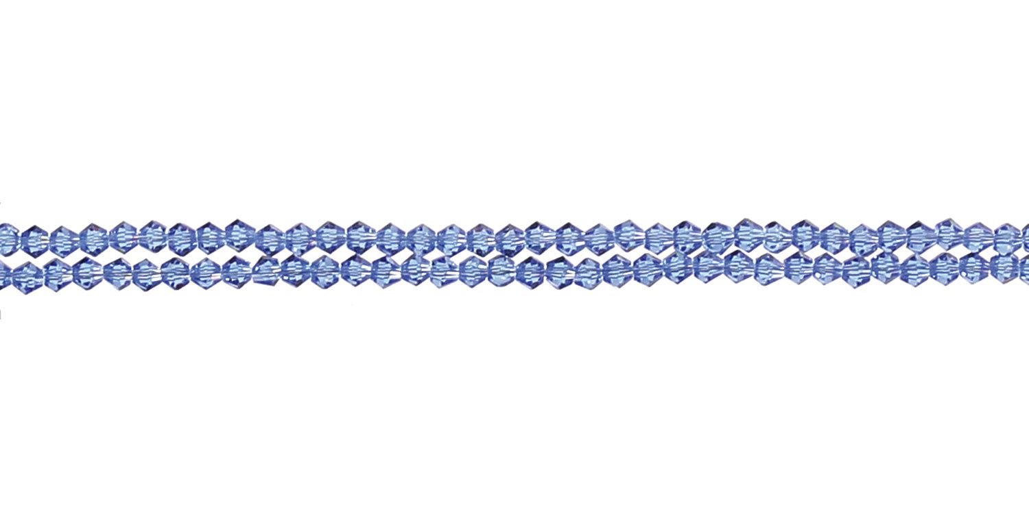 Catenina blu per occhiali con perline. Tre fili affiancati. Ambiente chiaro.