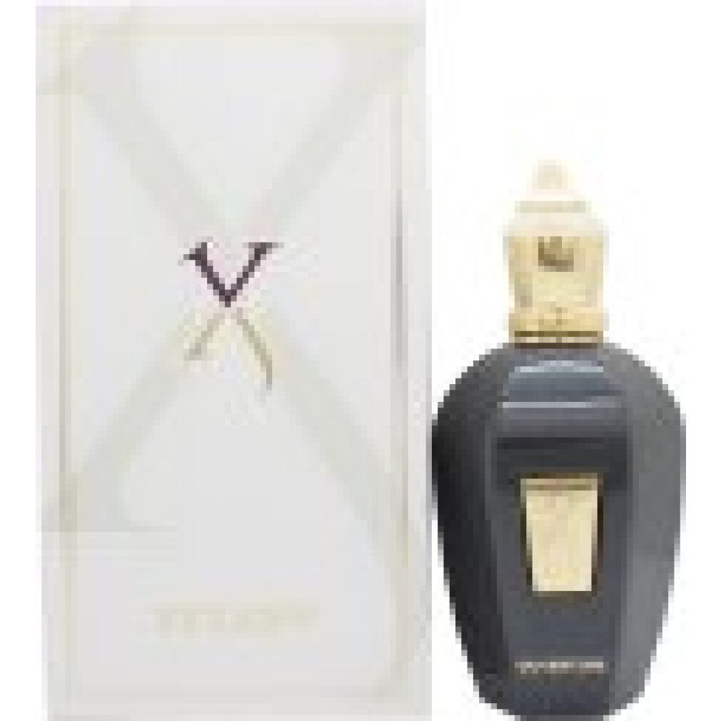 Flacone di profumo nero con tappo dorato e confezione bianca. Logo e scritta.