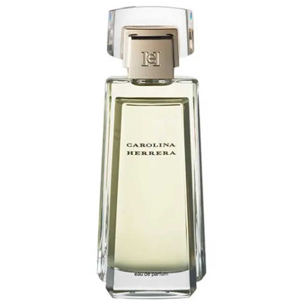 Flacone di profumo rettangolare in vetro trasparente, tappo dorato. Scritta: CAROLINA HERRERA. Eau de parfum.