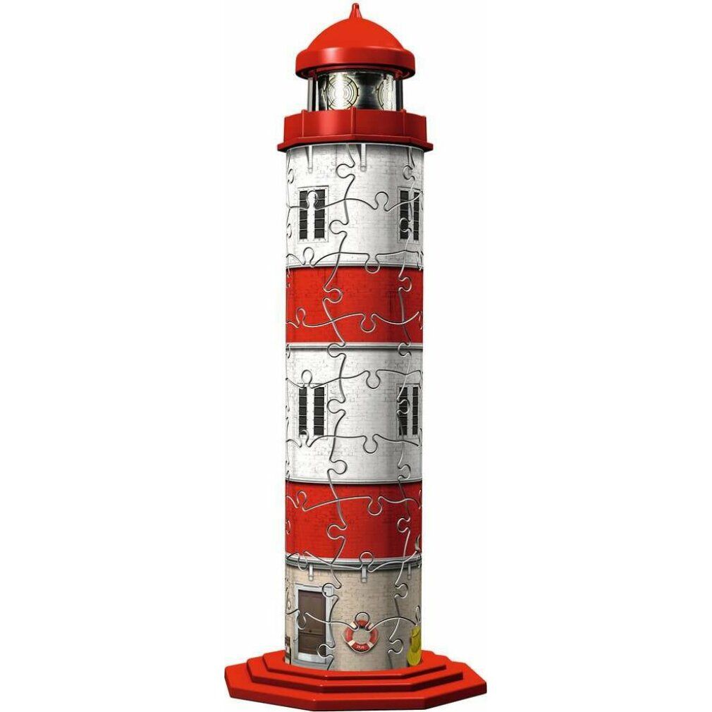 Puzzle 3D faro rosso e bianco. Forma cilindrica, finestre, porta, base e cima rosse. Pezzi del puzzle visibili.