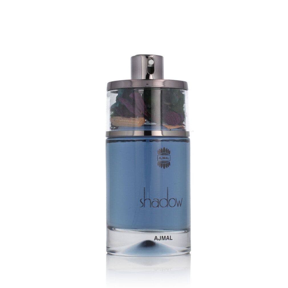 Flacone di profumo blu con tappo argentato. Il flacone ha la scritta "shadow". Elementi decorativi visibili nel tappo.