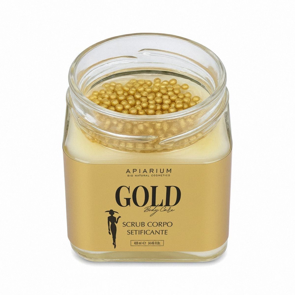 Apiarium Gold Body Scrub: vasetto in vetro aperto con perline dorate e scrub giallo.