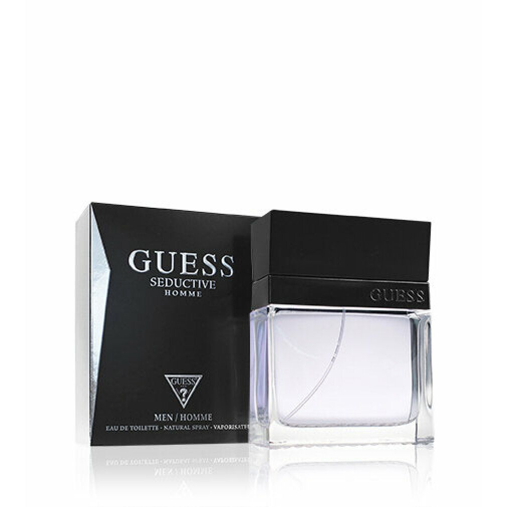 Guess Seductive Homme Eau de Toilette. Scatola e flacone neri. Flacone con tappo nero. Testo: GUESS, Seductive Homme, Eau de Toilette.