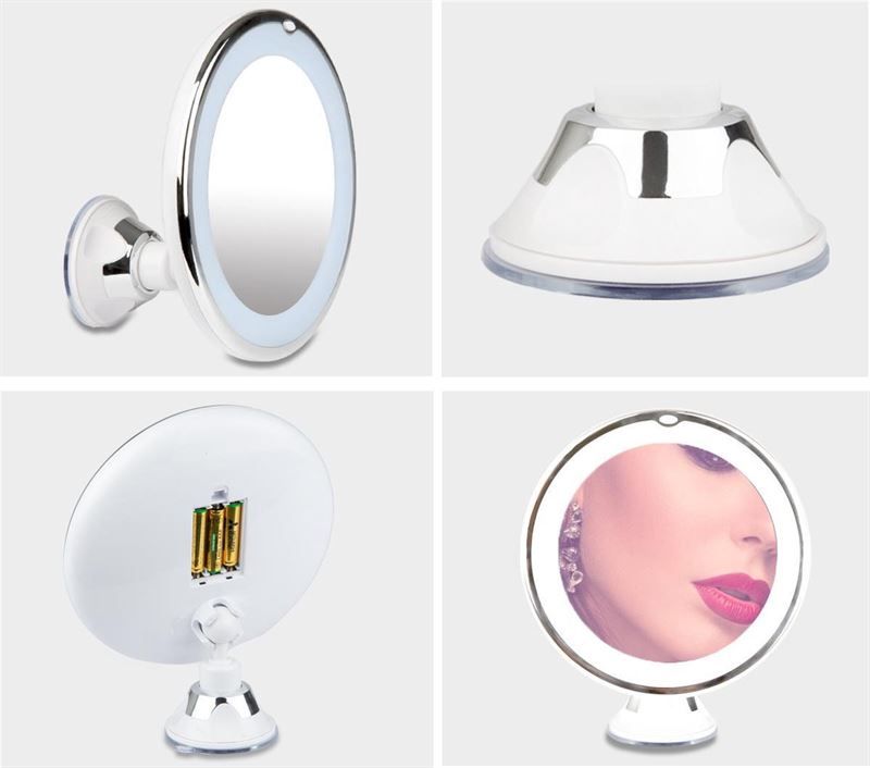Specchio cosmetico ovale con illuminazione LED e supporto a ventosa.