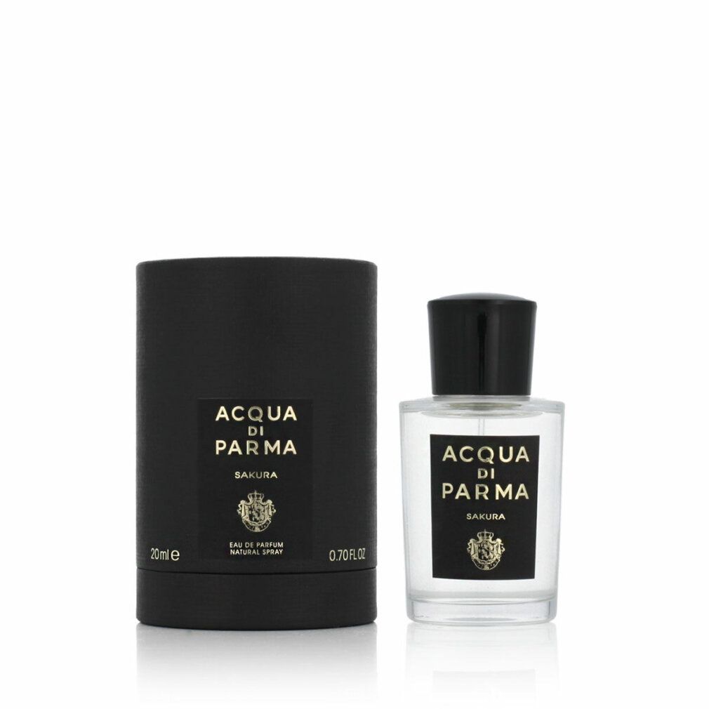 Confezione cilindrica nera e flacone. Scritta: ACQUA DI PARMA SAKURA. Logo. Flacone con tappo nero.