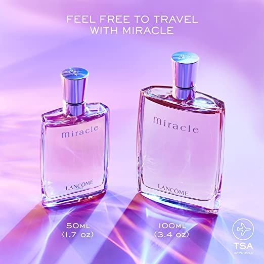 Due flaconi, uno piccolo, uno grande. Scritta "miracle" e "LANCOME". Testo: "FEEL FREE TO TRAVEL WITH MIRACLE".