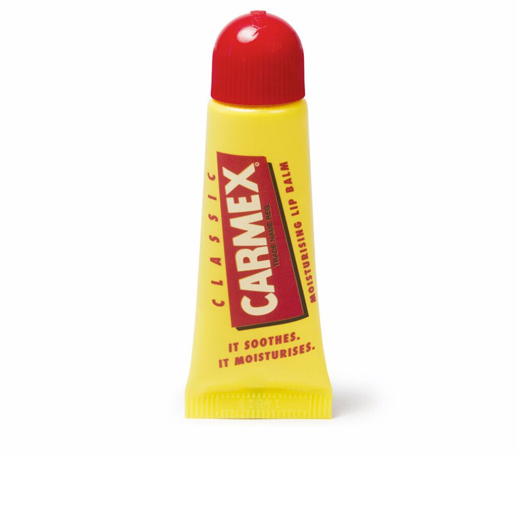 Tubo giallo con tappo rosso. Scritta Carmex in rosso. Classic. Moisturising Lip Balm. Testo: It soothes. It moisturises.