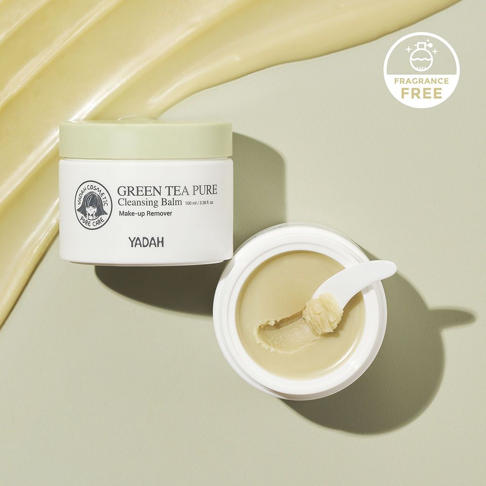Vasetto bianco con coperchio verde, aperto accanto. Scritta: Green Tea Pure Cleansing Balm. Con spatola. Logo: volto con scritta.