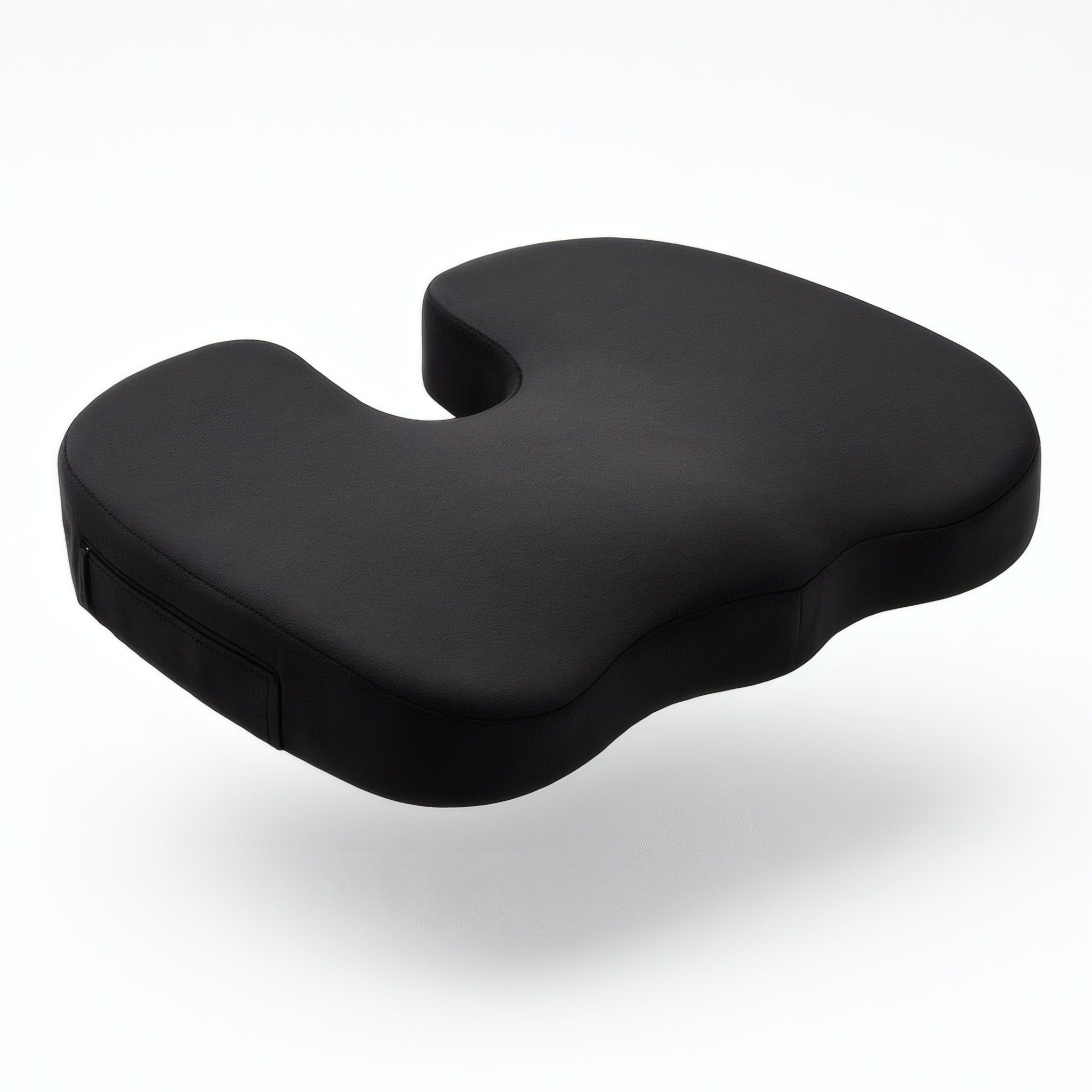 Cuscino ergonomico nero con incavo per una seduta senza pressione.