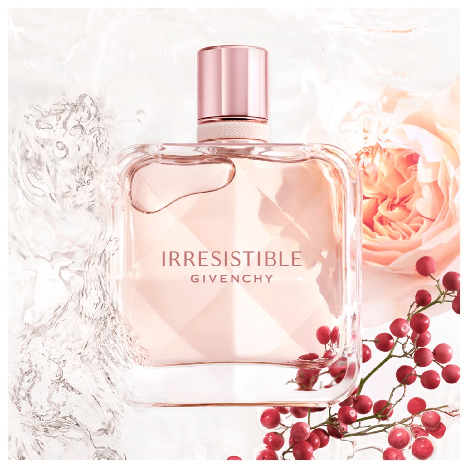Flacone quadrato, contenuto rosa, circondato da acqua, rose e bacche rosse. Scritta: Irresistible Givenchy.