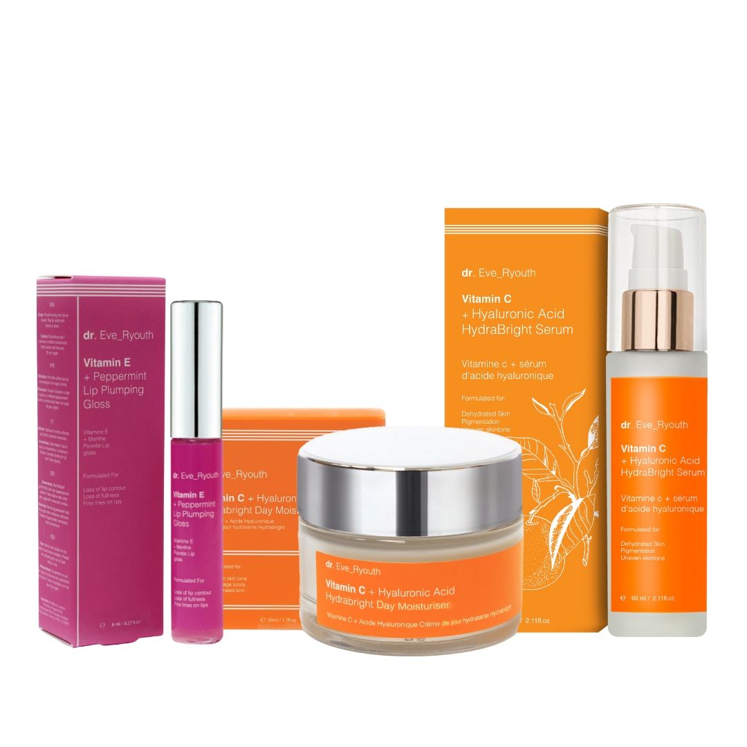 Prodotti cosmetici con confezione: crema, siero, lucidalabbra. Vasi di crema e siero con etichette arancioni. Lucidalabbra rosa.