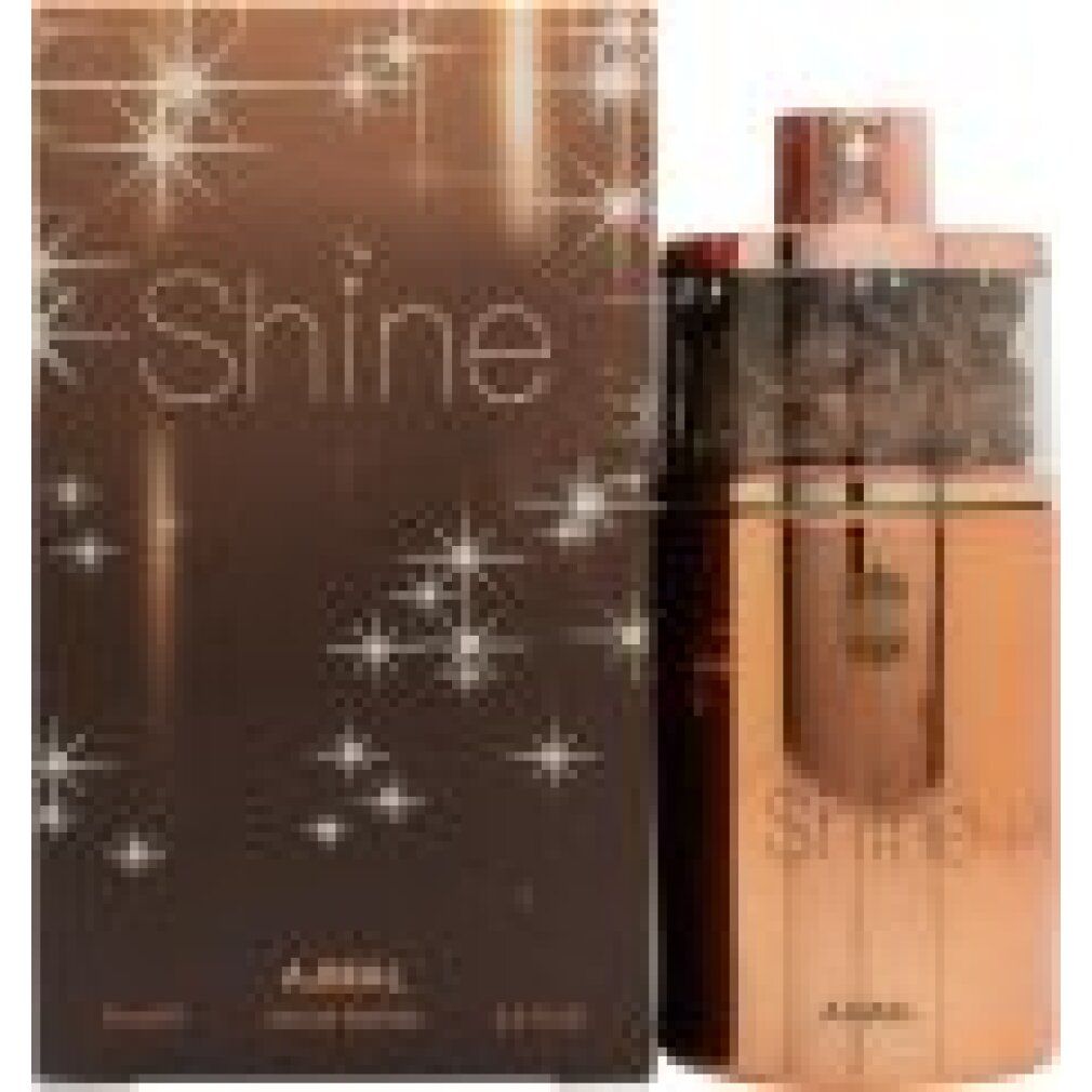 Flacone di profumo e scatola. Flacone color rame. Scatola marrone con motivo a stelle. Marchio Ajmal.