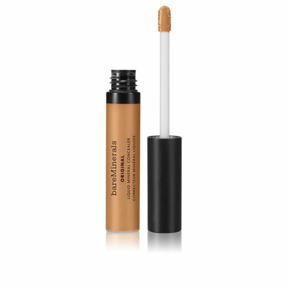 Correttore liquido marrone. Flacone con tappo nero e applicatore. Nome del prodotto e testo sul flacone.