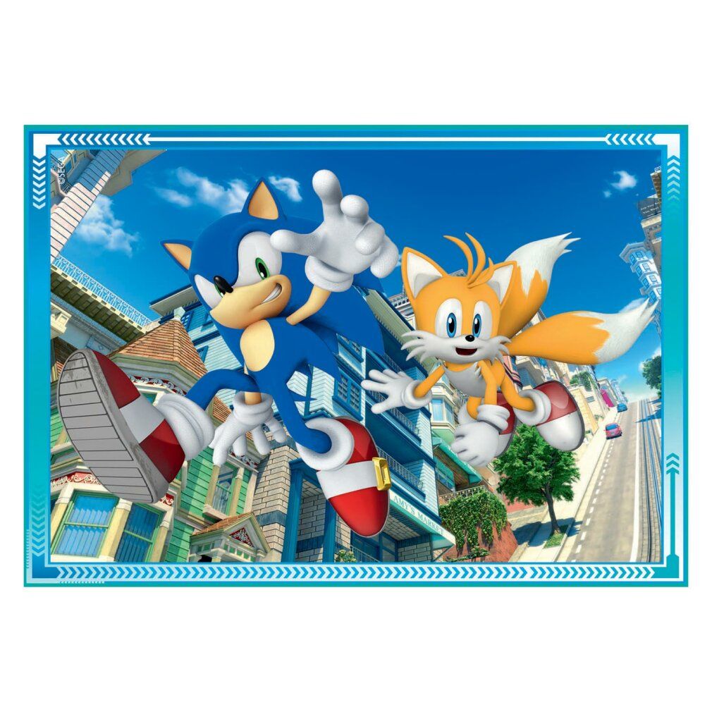 Puzzle con Sonic e Tails. Personaggi davanti a cielo blu e case. Cornice blu con motivo a frecce.