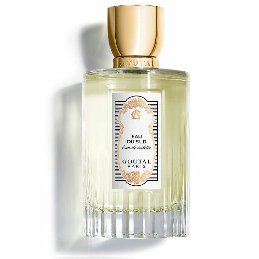 Goutal Paris Eau Du Sud Eau De Toilette Spray. Flacone rettangolare in vetro, tappo dorato. Etichetta bianca con testo e decorazioni.