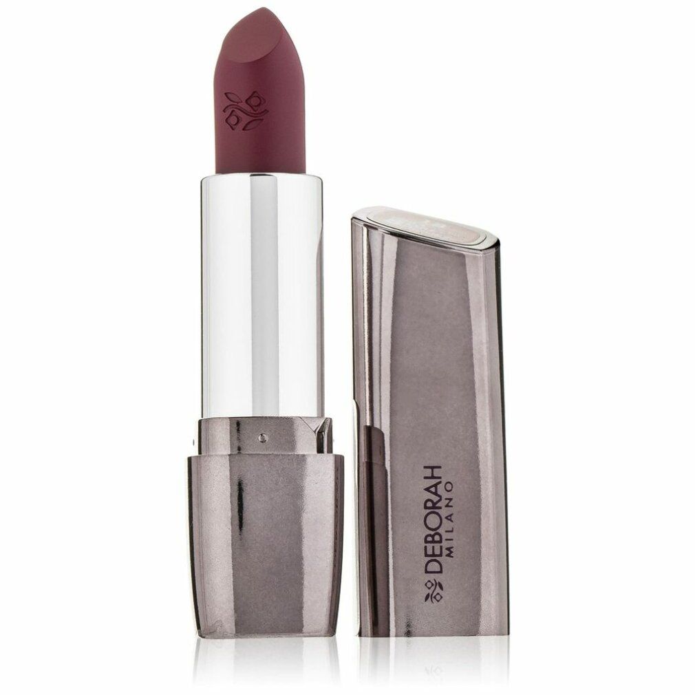 Rossetto con astuccio aperto. Rossetto rosso scuro, astuccio argentato. Deborah Milano è scritto sull'astuccio.