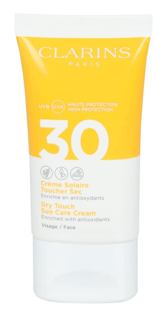 Clarins Crème Solaire Visage UVA/UVB 30. Tubo giallo con tappo bianco. Scritte: 30, Crème Solaire, Dry Touch, Visage/Face.