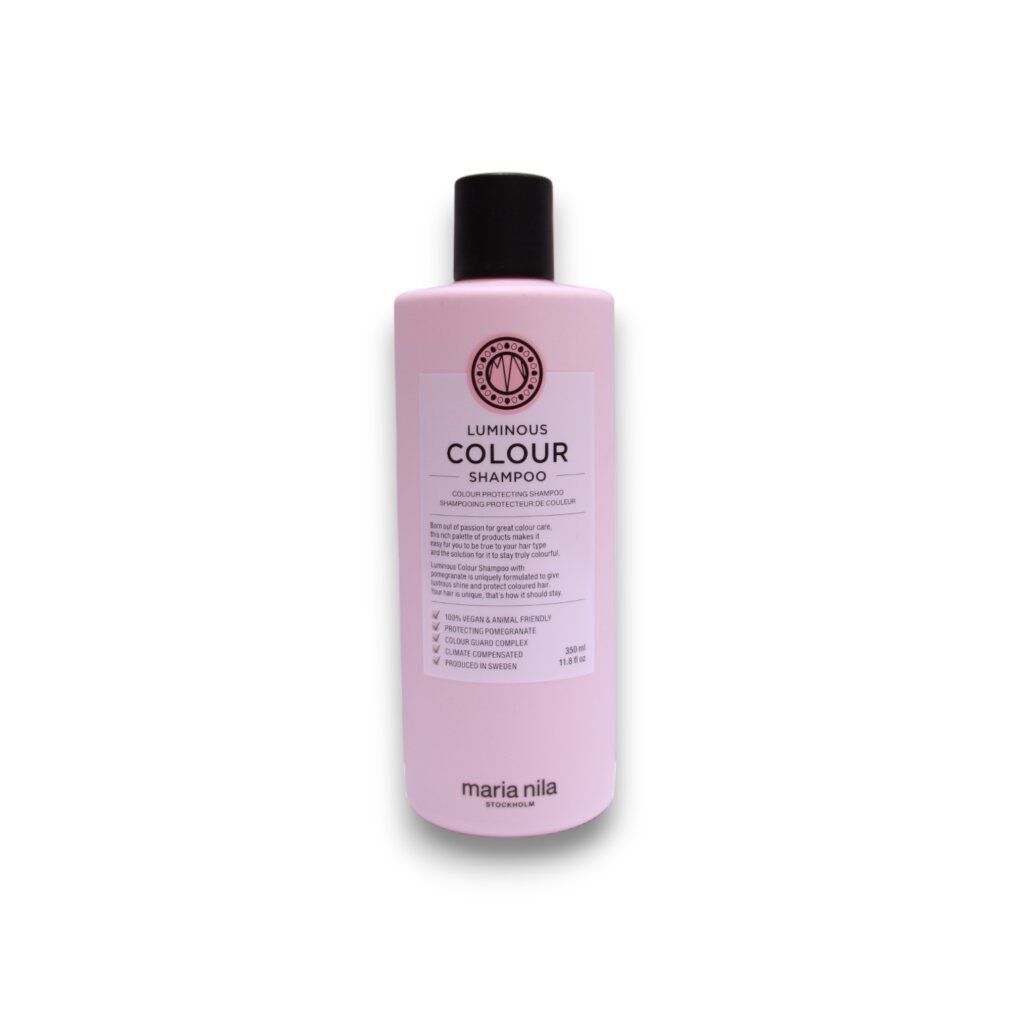 Flacone di shampoo rosa con tappo nero. Etichetta con testo: Luminous Colour Shampoo. Marchio: Maria Nila.