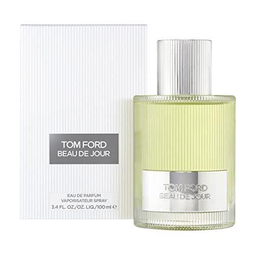 Flacone con liquido verde chiaro e tappo argentato. Confezione bianca con nome del prodotto. Testo: TOM FORD BEAU DE JOUR.