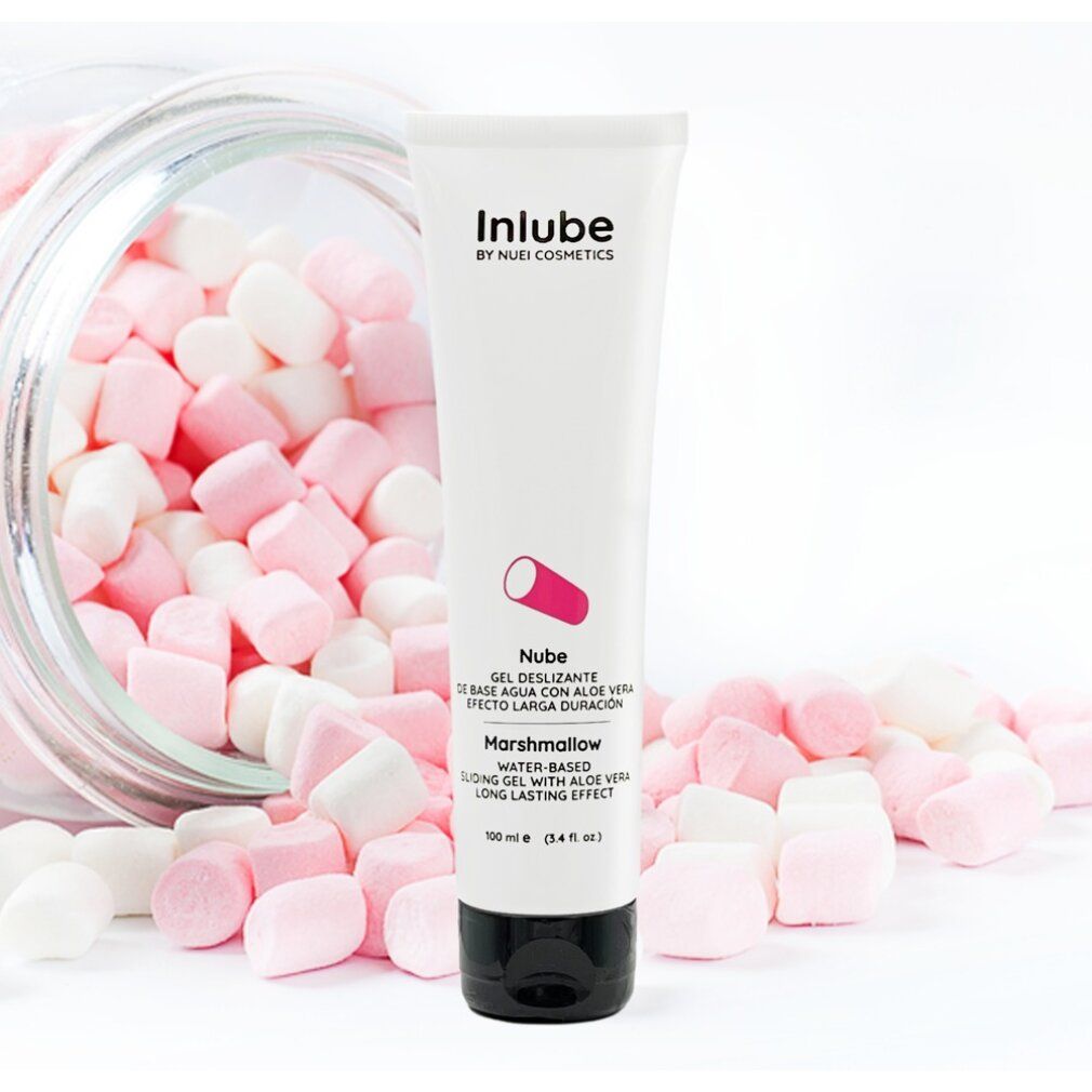 Tubo bianco con tappo nero, circondato da marshmallow rosa e bianchi in un barattolo. Scritta: Inlube by NUEI Cosmetics, Nube, Marshmallow.