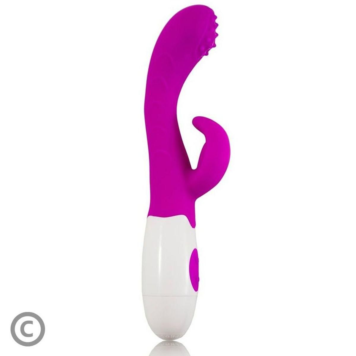 Vibratore lilla e bianco, forma curva, orecchie di coniglio. Pulsante sull'impugnatura. Testa con noduli.