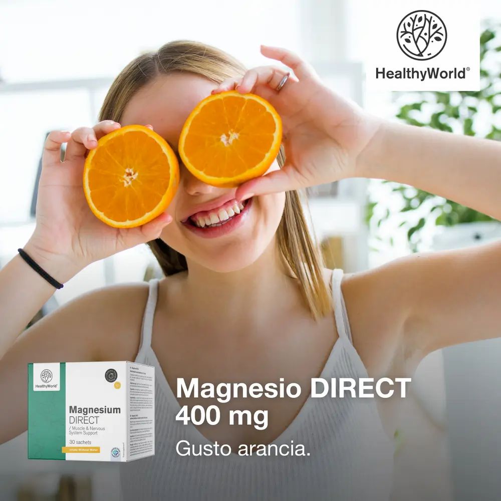 Donna con arance davanti agli occhi. Magnesio DIRECT 400 mg, Gusto arancia. Marchio HealthyWorld.