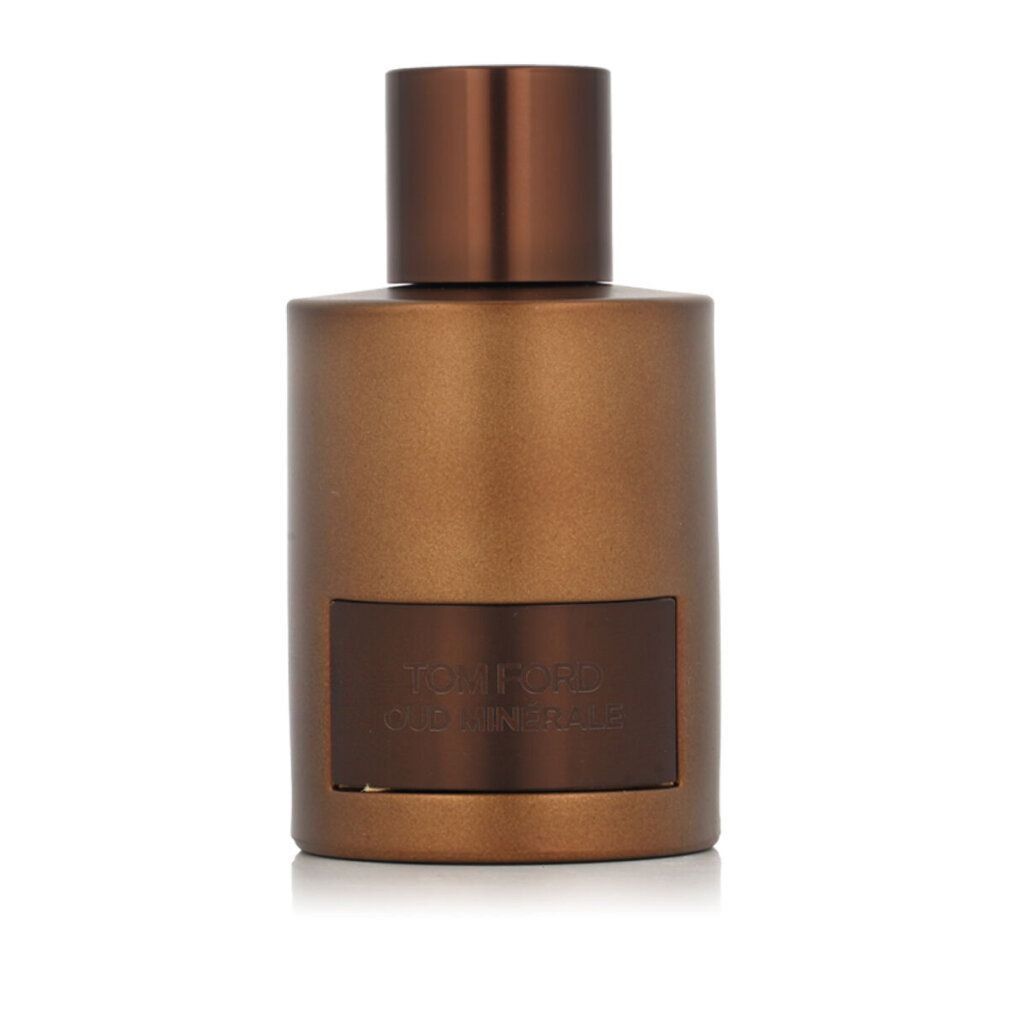 Flacone dorato con tappo marrone ed etichetta rettangolare con testo TOM FORD OUD MINERALE.