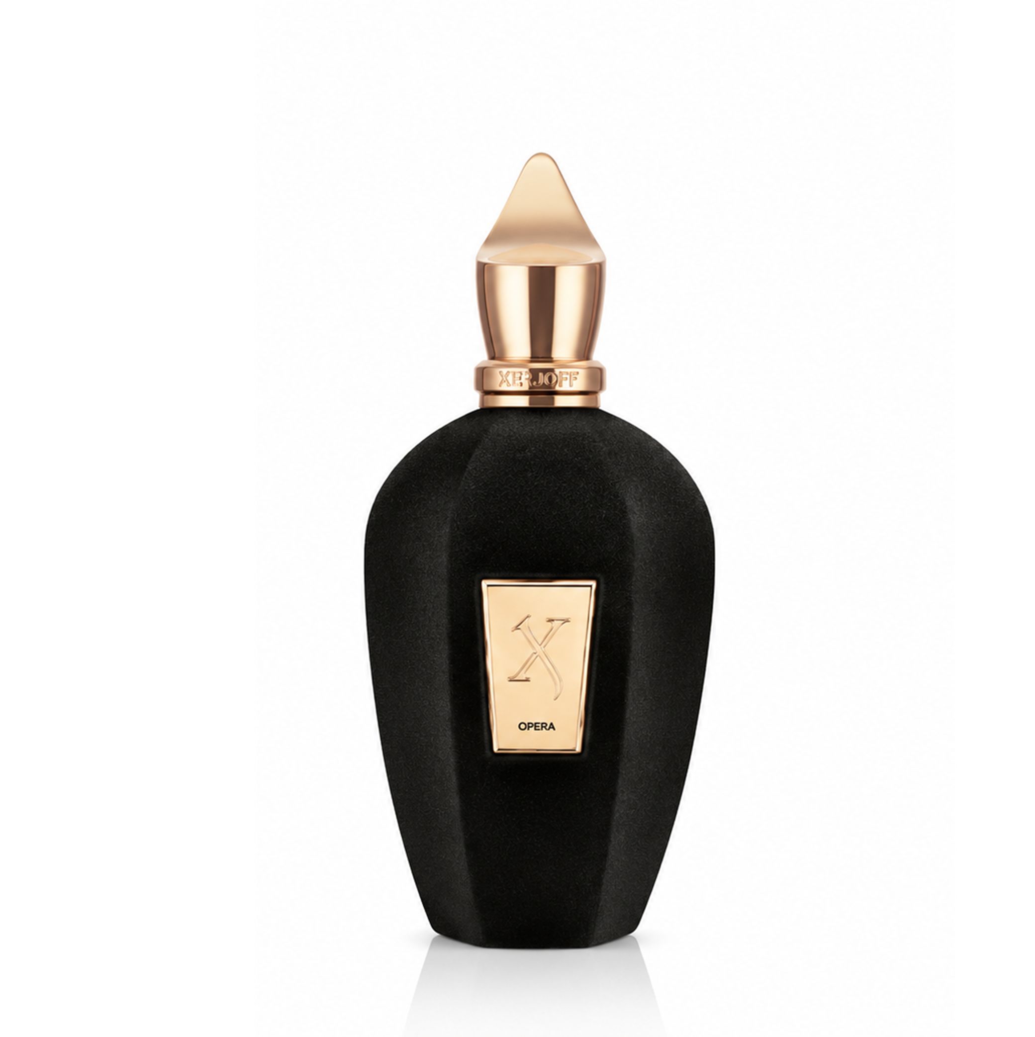 Flacone di profumo nero dal design sfaccettato, con tappo ed etichetta dorati.