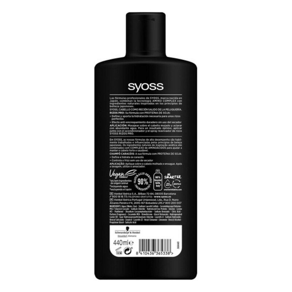 Retro di un flacone di shampoo nero. Testo: Syoss, Rizos Pro, Champú, Proteína de Soja. Logo vegano, indicazioni riciclo, ingredienti.