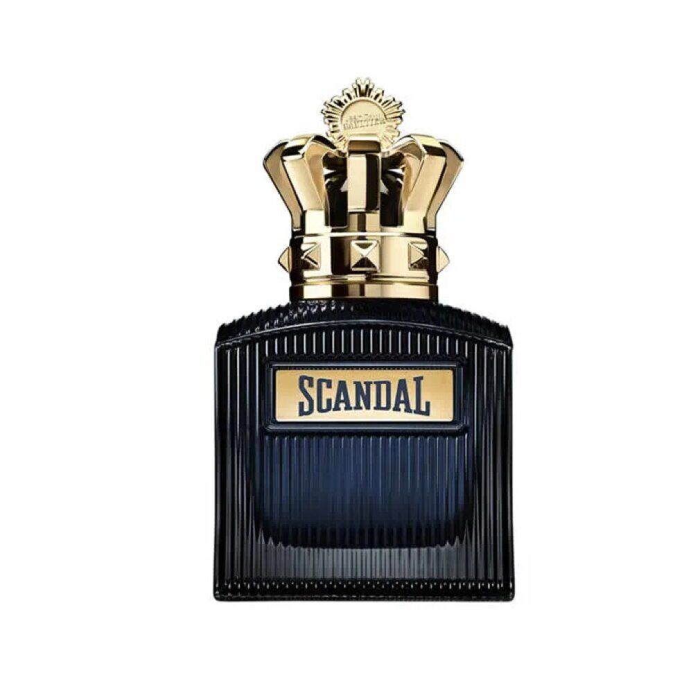 Flacone blu scuro con tappo a corona dorata. Scritta "SCANDAL" su etichetta rettangolare.