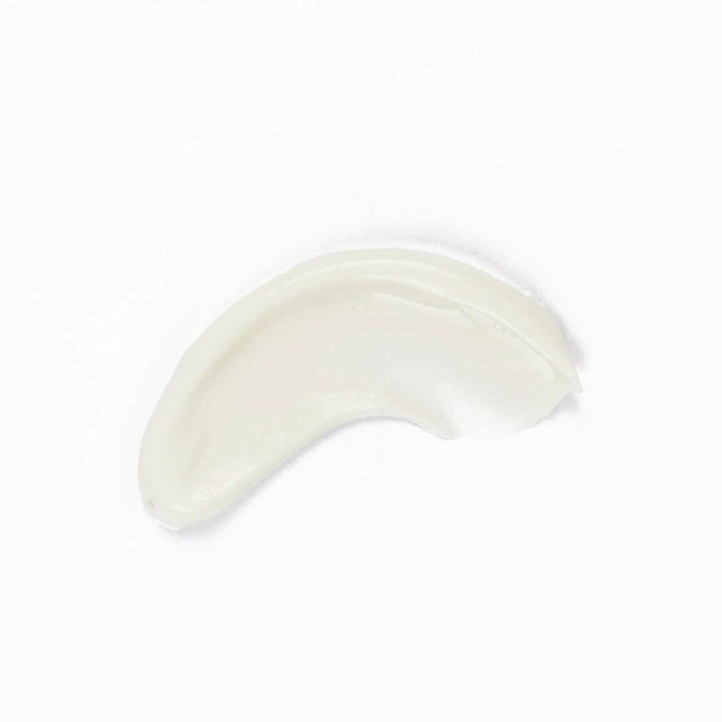 Crema color crema spalmata su sfondo bianco. Forma: curva.