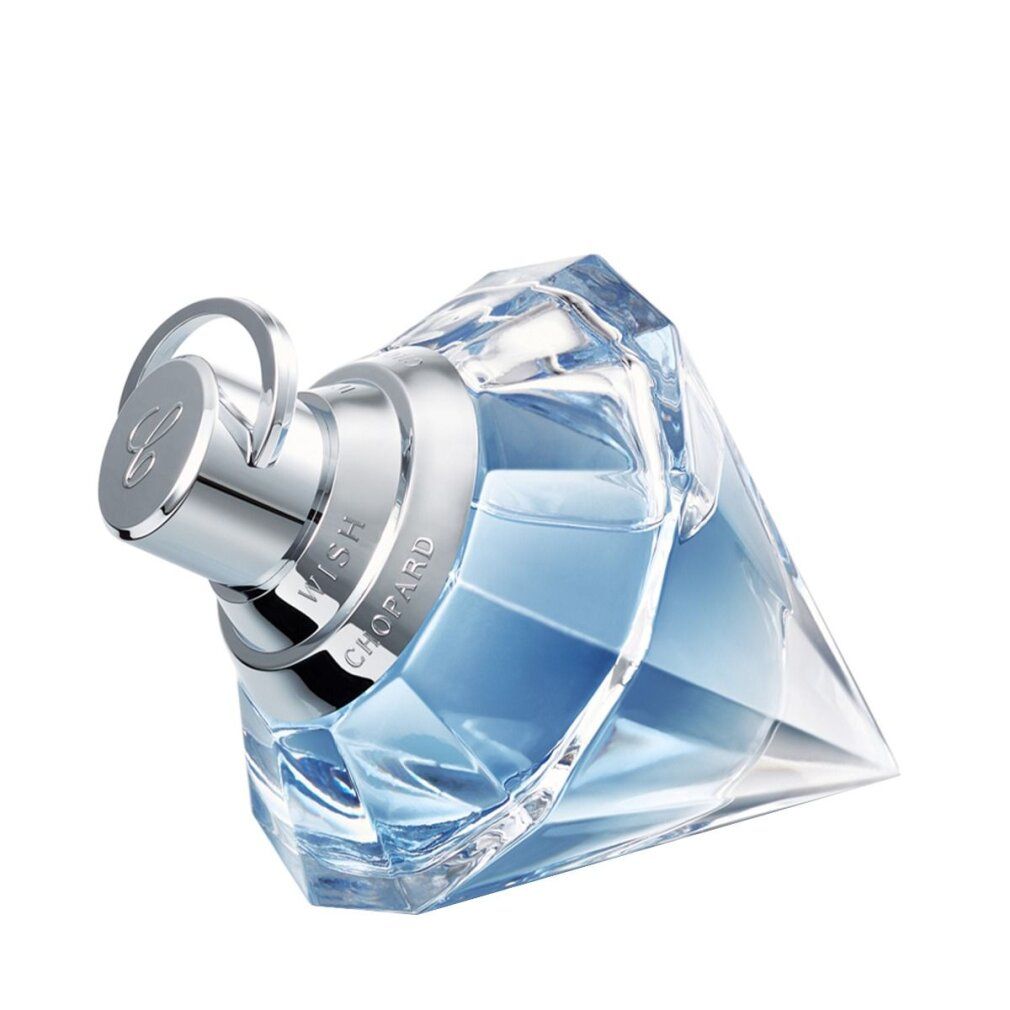 Flacone di vetro a forma di diamante con profumo azzurro, inclinato, con tappo argentato.