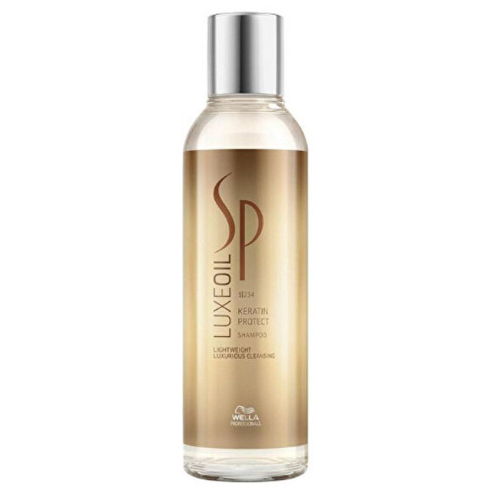 Flacone di shampoo con tappo argentato. Scritta: SP Luxe Oil Keratin Protect.