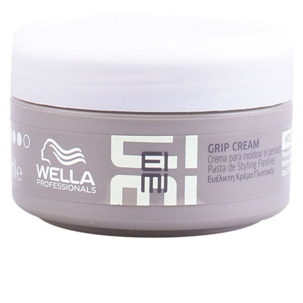 Barattolo di Wella Eimi Grip Cream. Barattolo grigio con coperchio bianco. Scritta Eimi e Grip Cream.